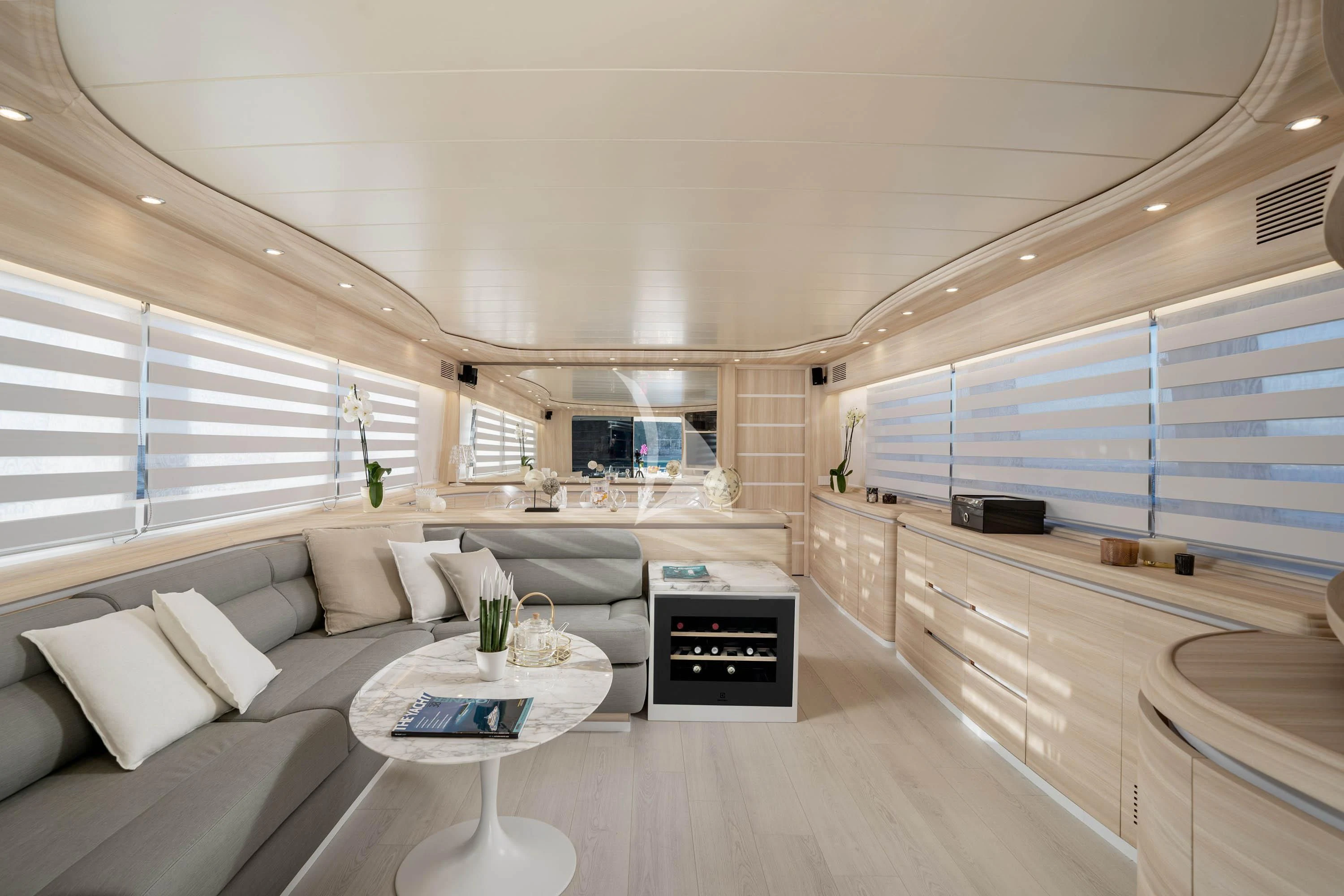 a living room with a large window aboard GEMINI 3 Yacht for Charter