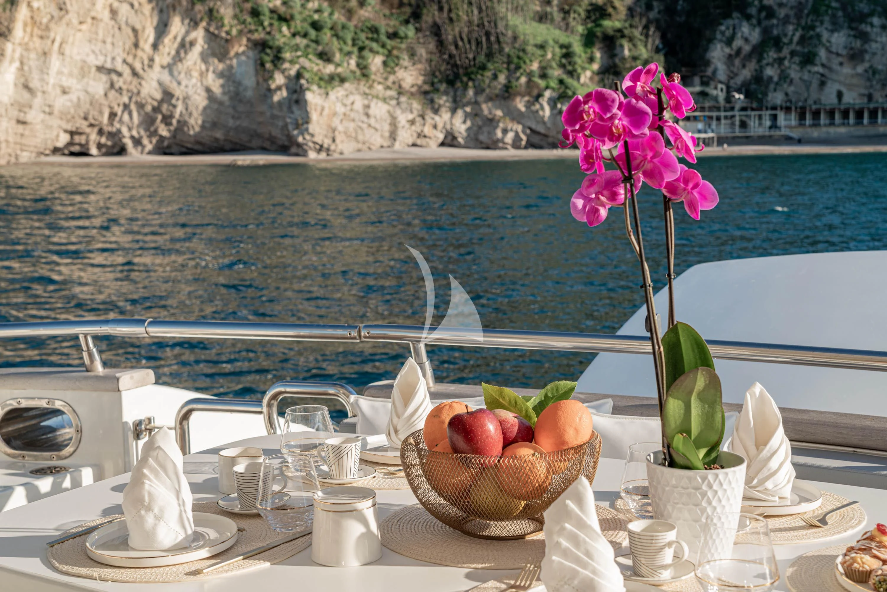 a flower on a table aboard GEMINI 3 Yacht for Charter
