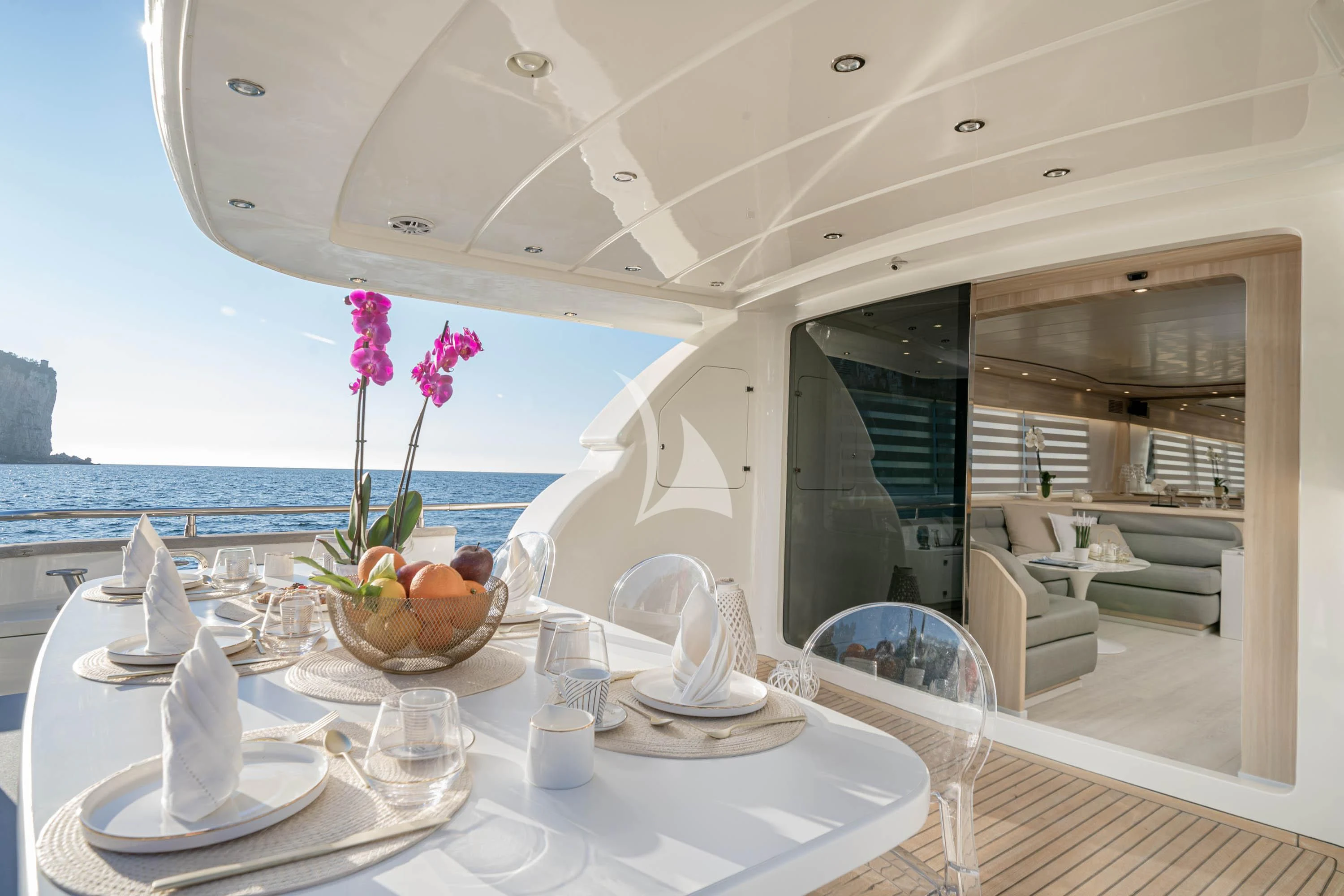 a table with glasses and plates on it aboard GEMINI 3 Yacht for Charter