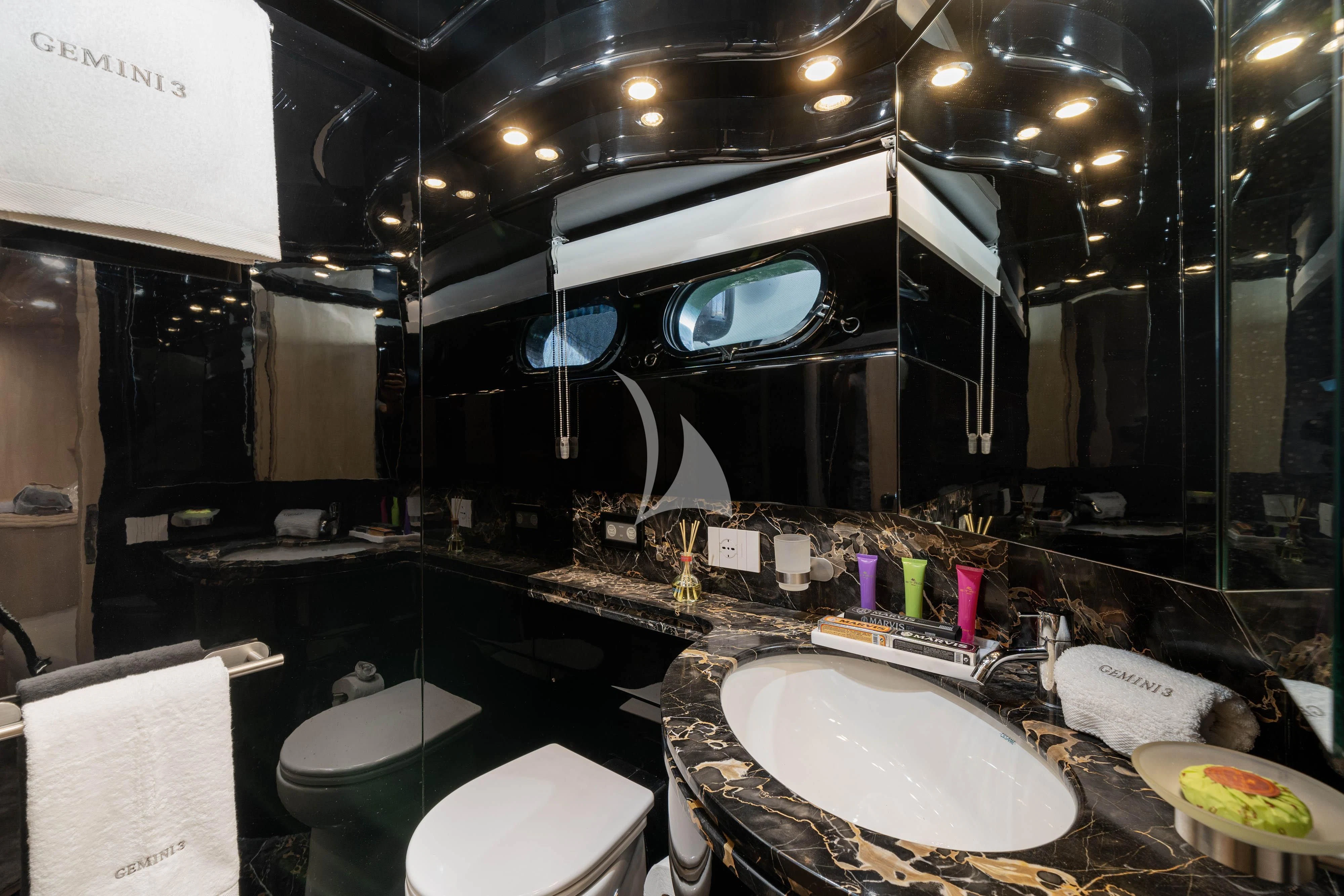 a bathroom with a large mirror aboard GEMINI 3 Yacht for Charter