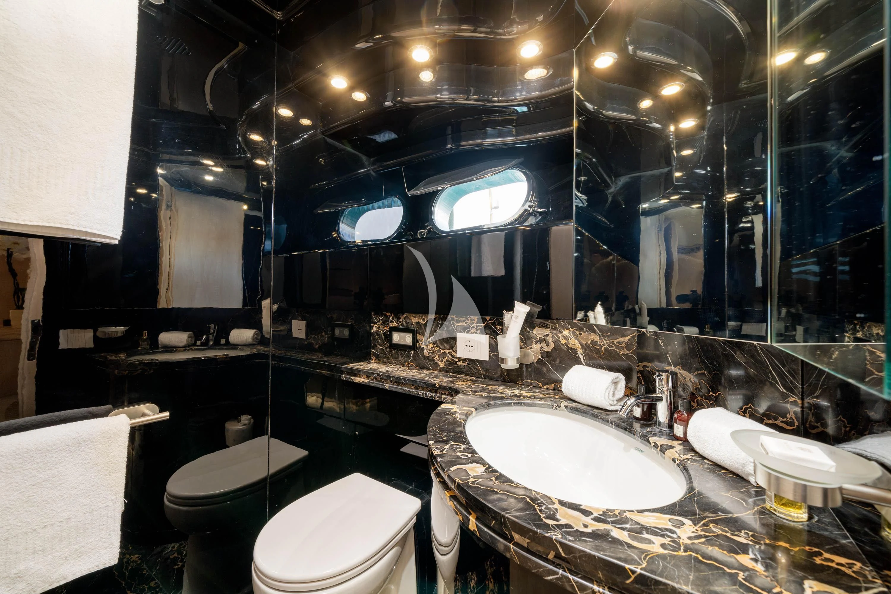 a bathroom with a large mirror aboard GEMINI 3 Yacht for Charter