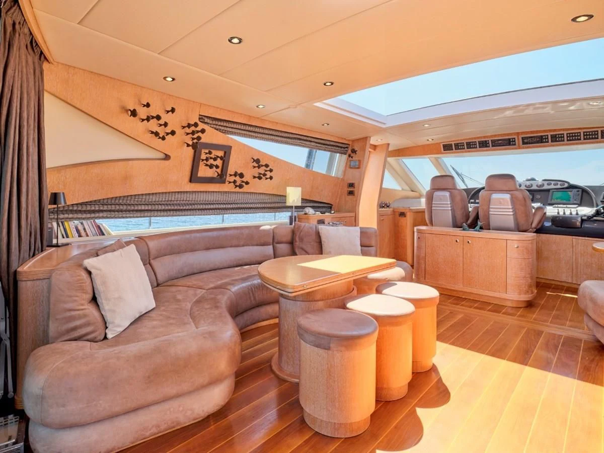 a room with a couch and a table aboard HUNTING STAR Yacht for Sale