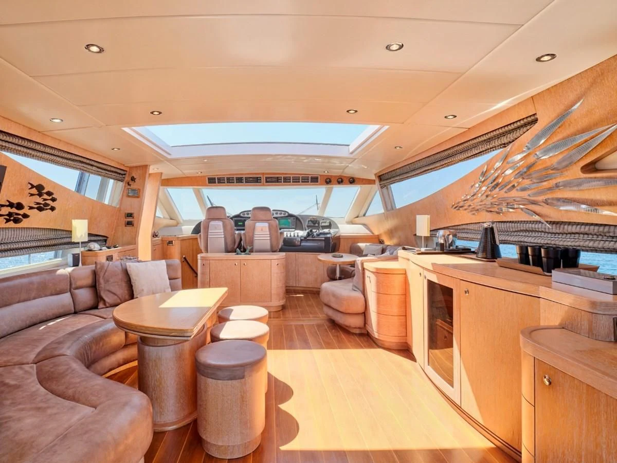 a large living room with a large open roof aboard HUNTING STAR Yacht for Sale
