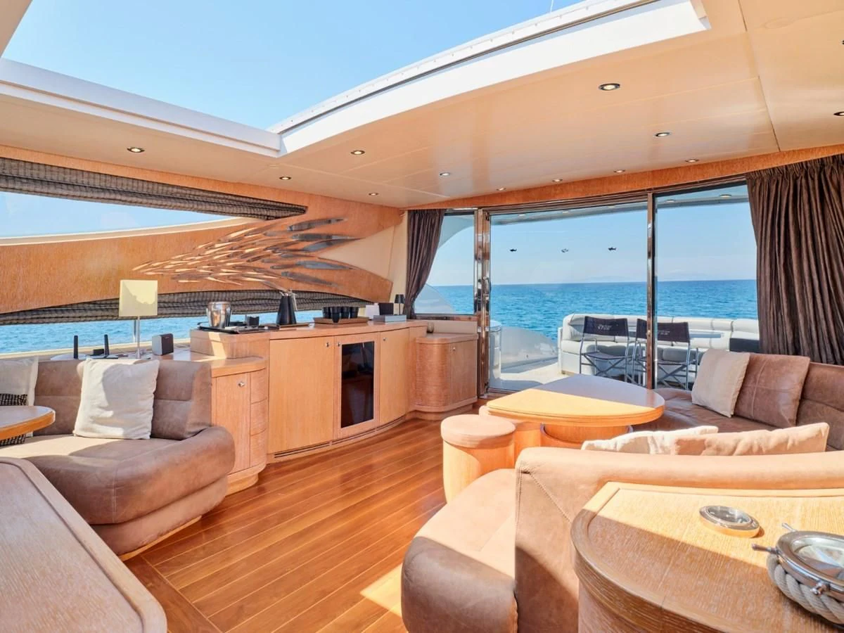 a living room with a large window aboard HUNTING STAR Yacht for Sale