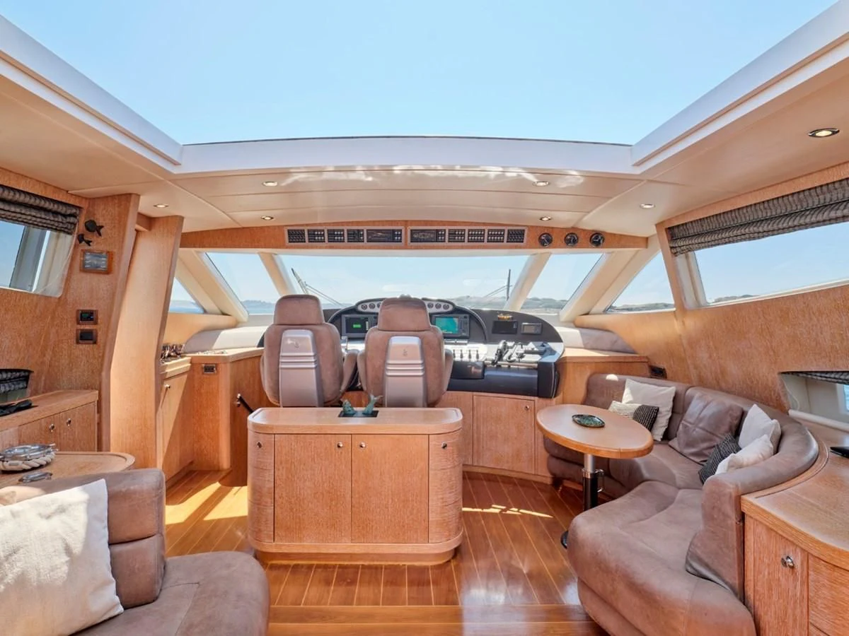 a room with a couch and a table and chairs aboard HUNTING STAR Yacht for Sale