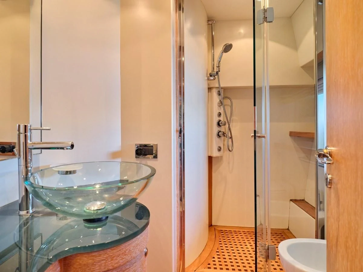 a bathroom with a sink and a mirror aboard HUNTING STAR Yacht for Sale