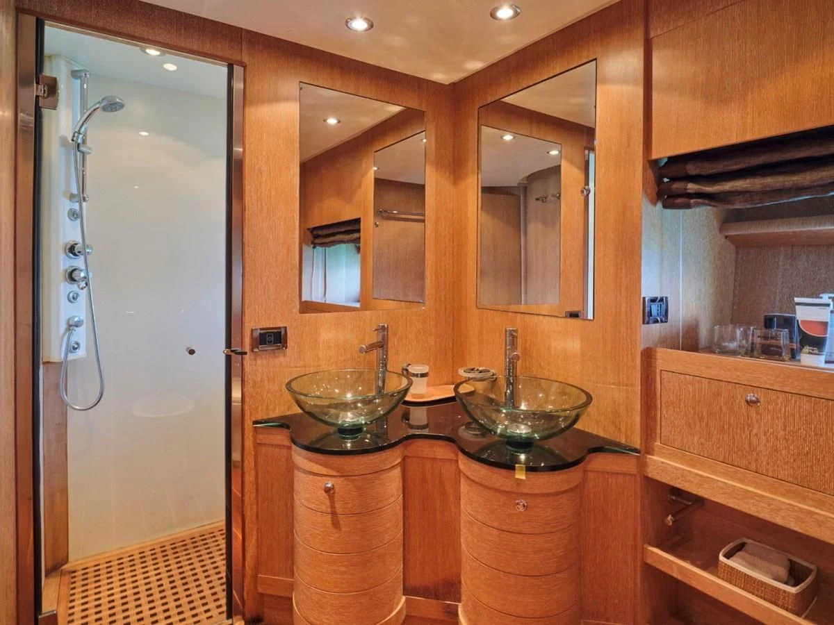 a bathroom with a sink and a shower aboard HUNTING STAR Yacht for Sale