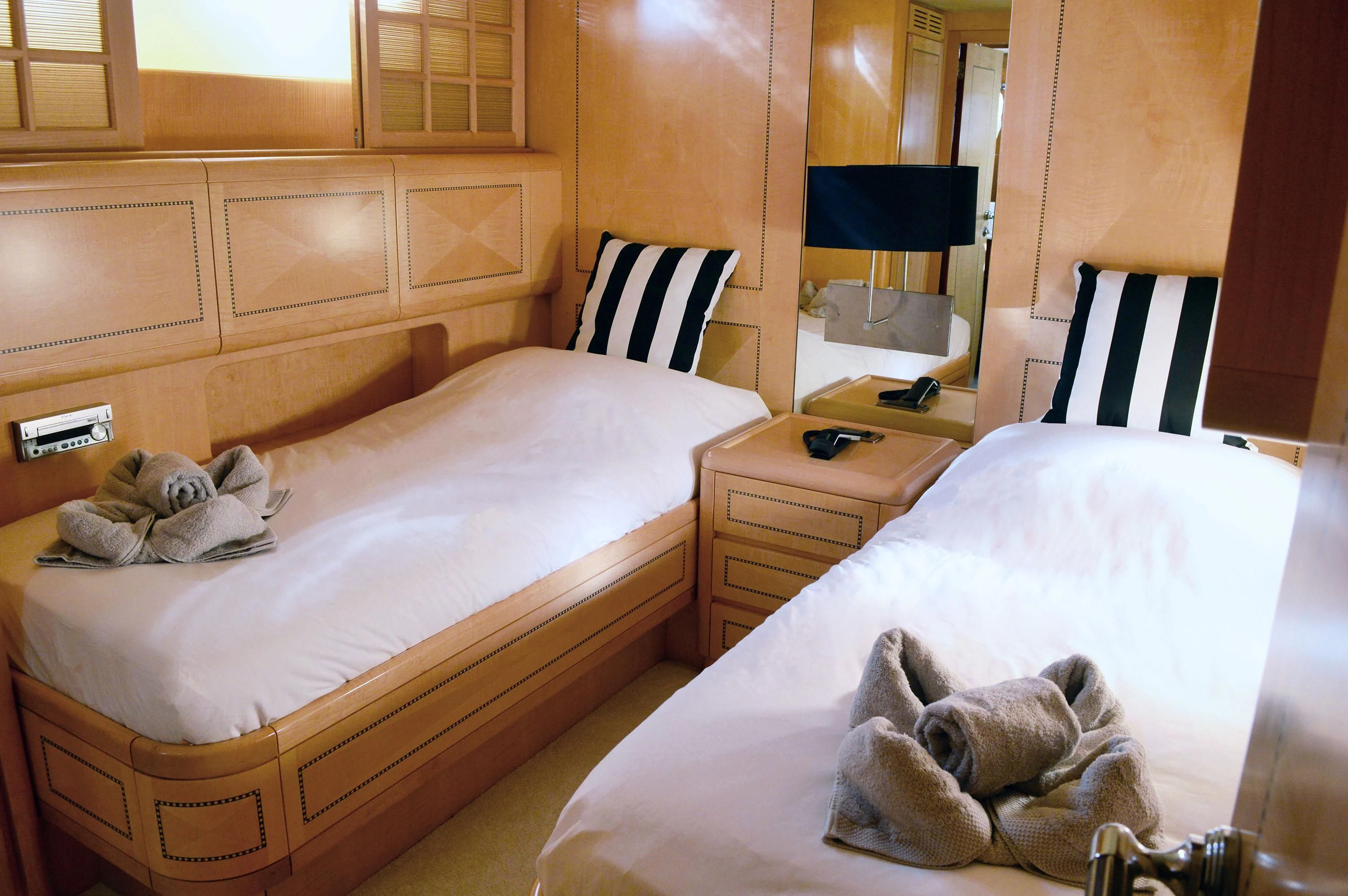 a cat lying on a bed aboard EL PRIMERO Yacht for Sale