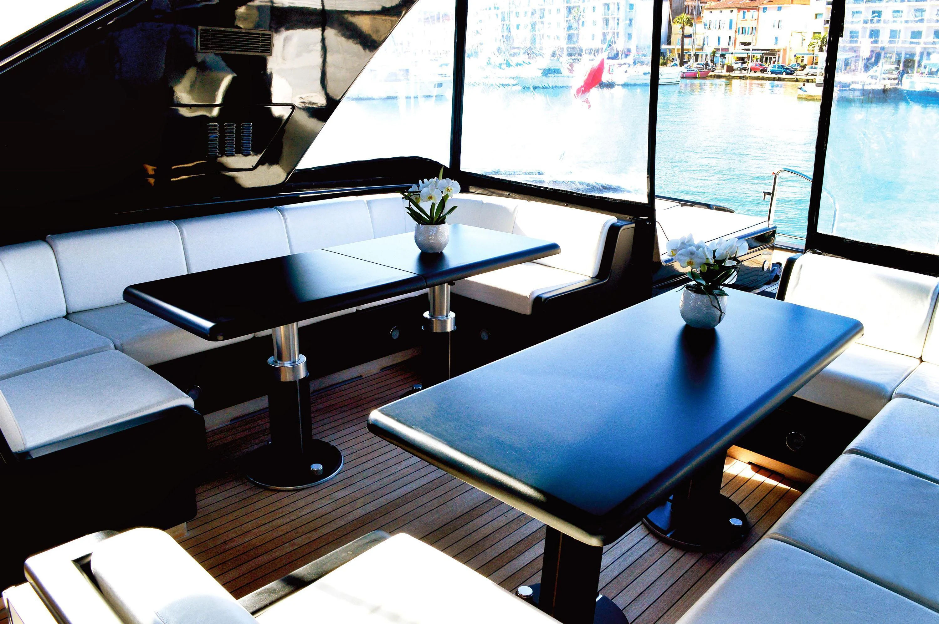 a room with a table and chairs aboard EL PRIMERO Yacht for Sale