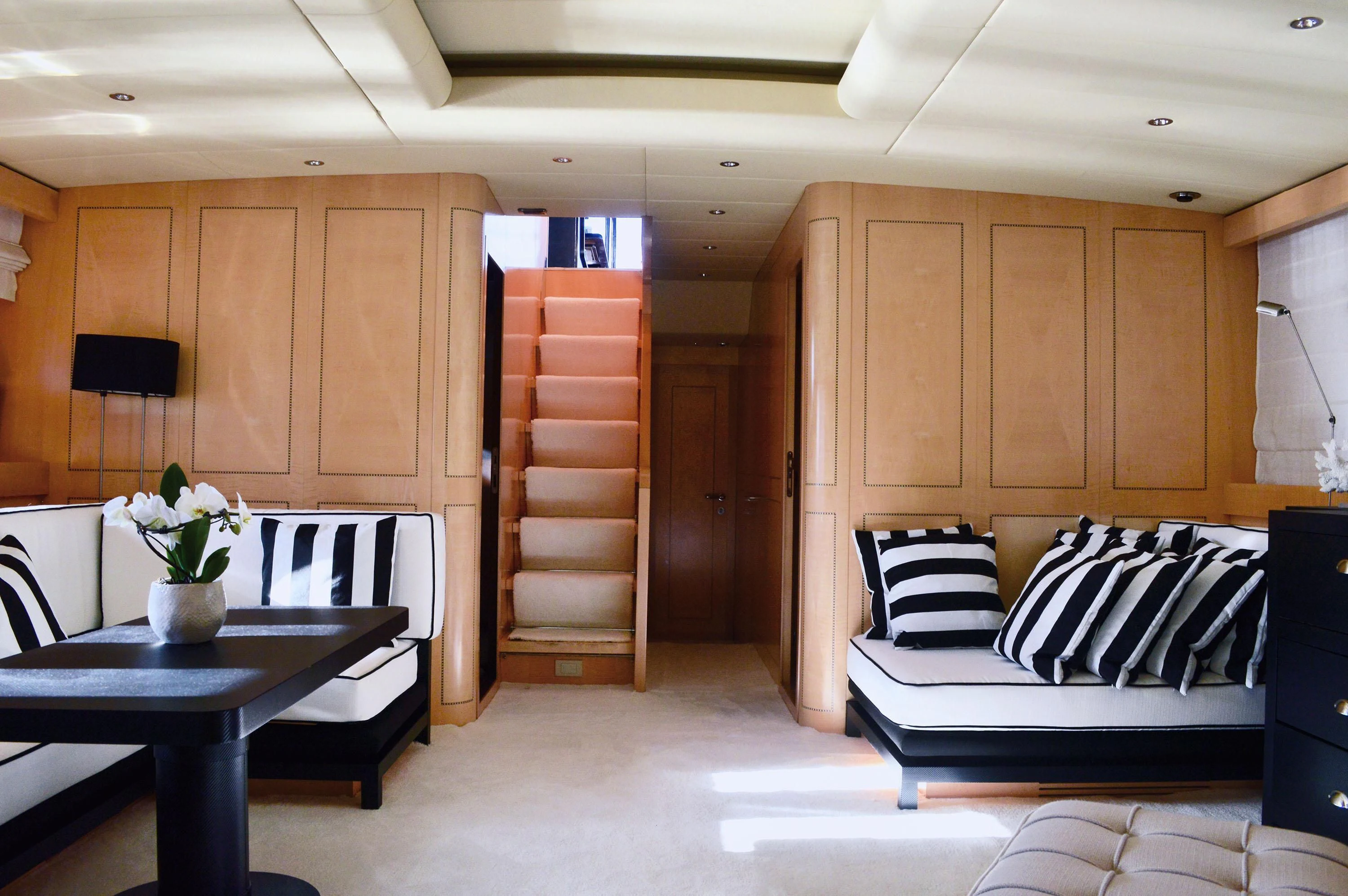 a room with a couch and a table aboard EL PRIMERO Yacht for Sale