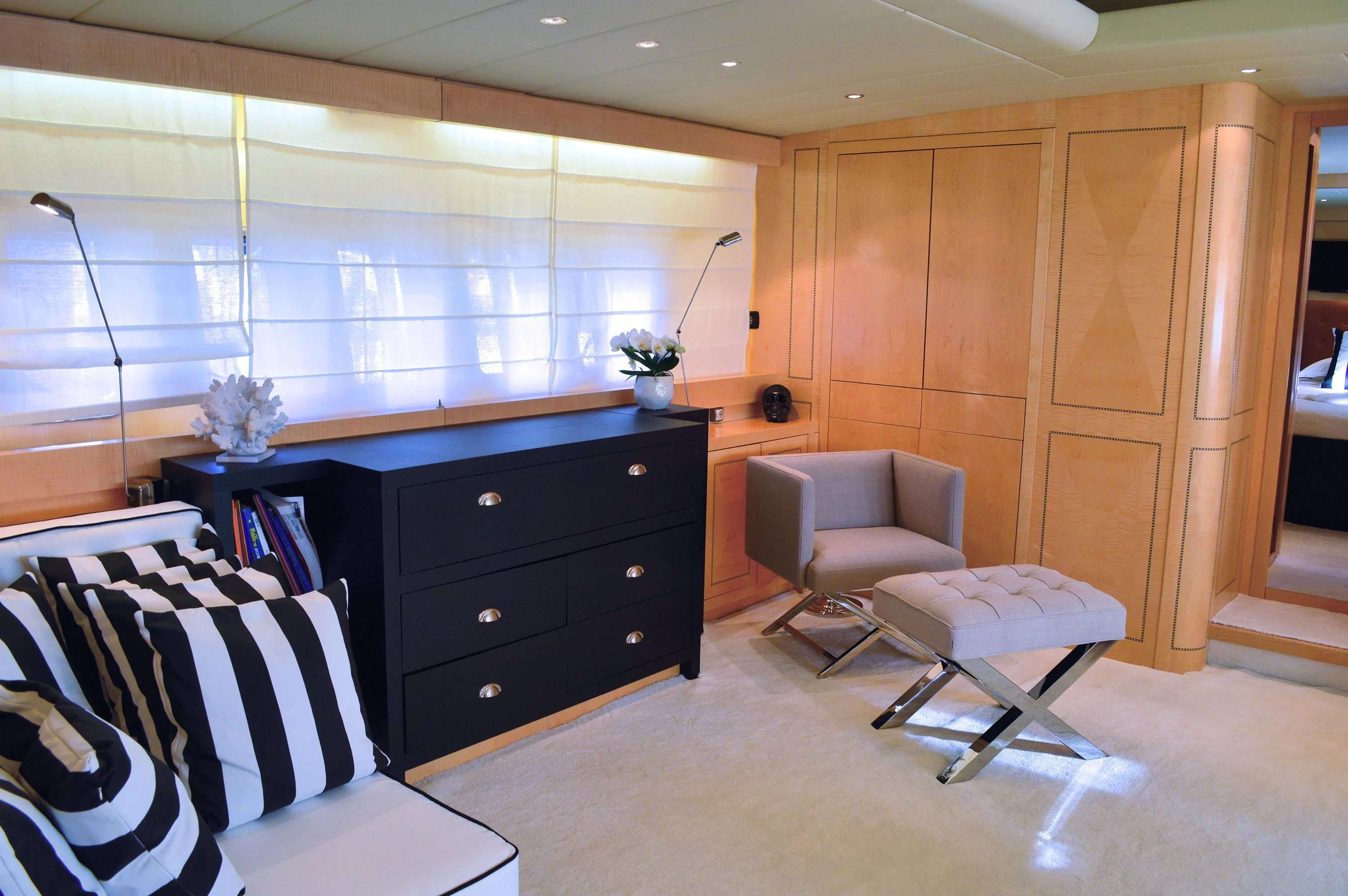 a room with a desk and chairs aboard EL PRIMERO Yacht for Sale