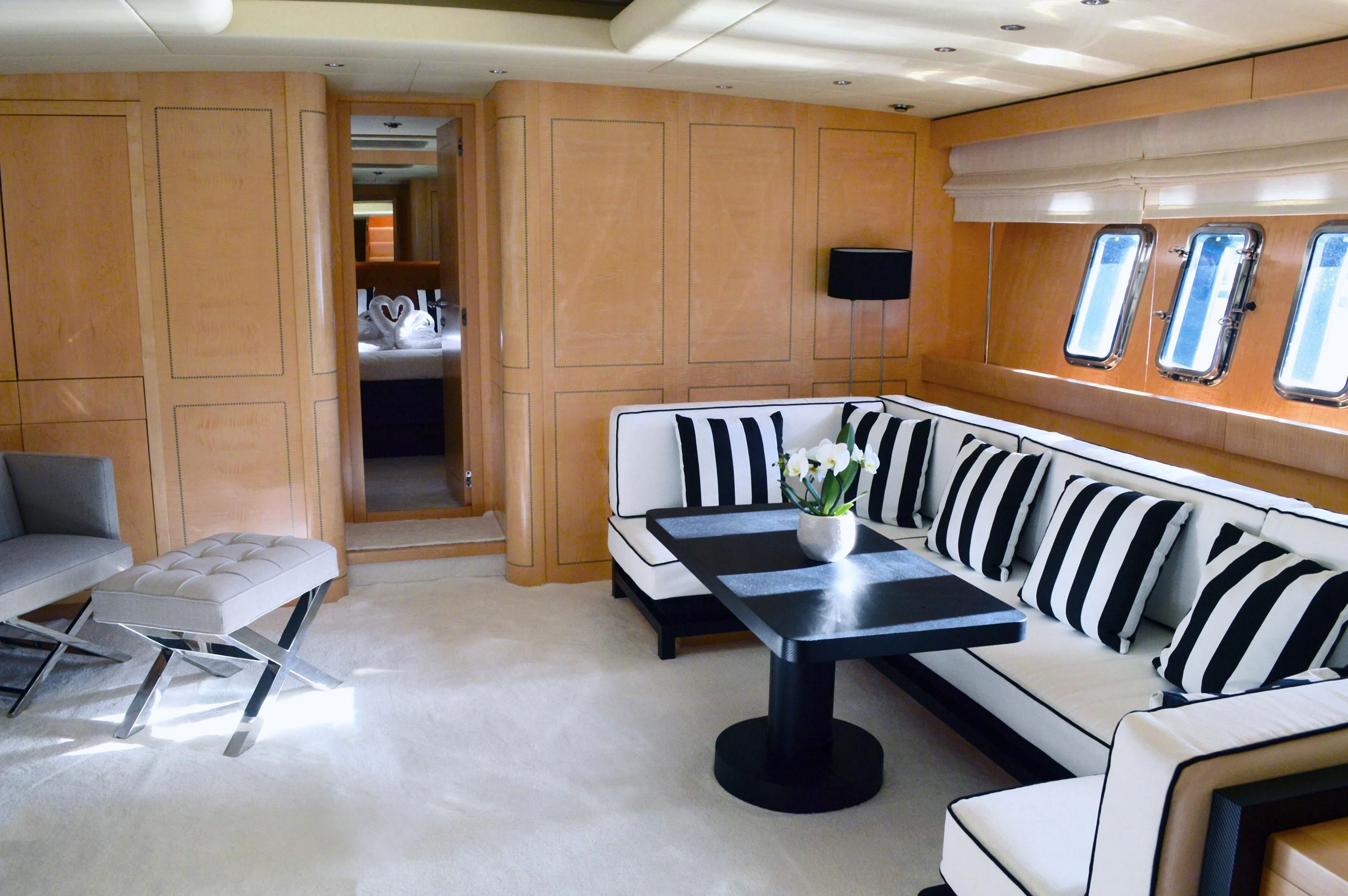 a room with a table and chairs aboard EL PRIMERO Yacht for Sale