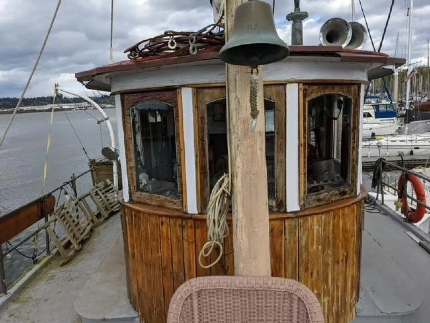 a wooden boat on a dock aboard EL PRIMERO Yacht for Sale