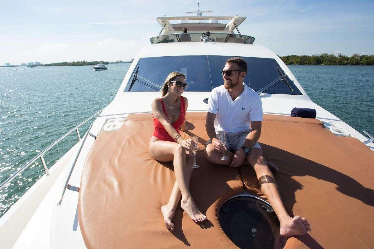 a man and woman sitting on a boat aboard BLUOCEAN Yacht for Sale