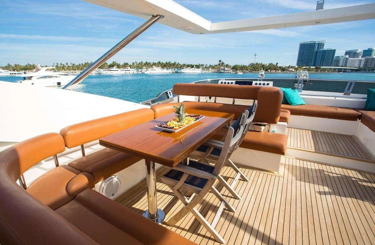a room with a table and chairs aboard BLUOCEAN Yacht for Sale