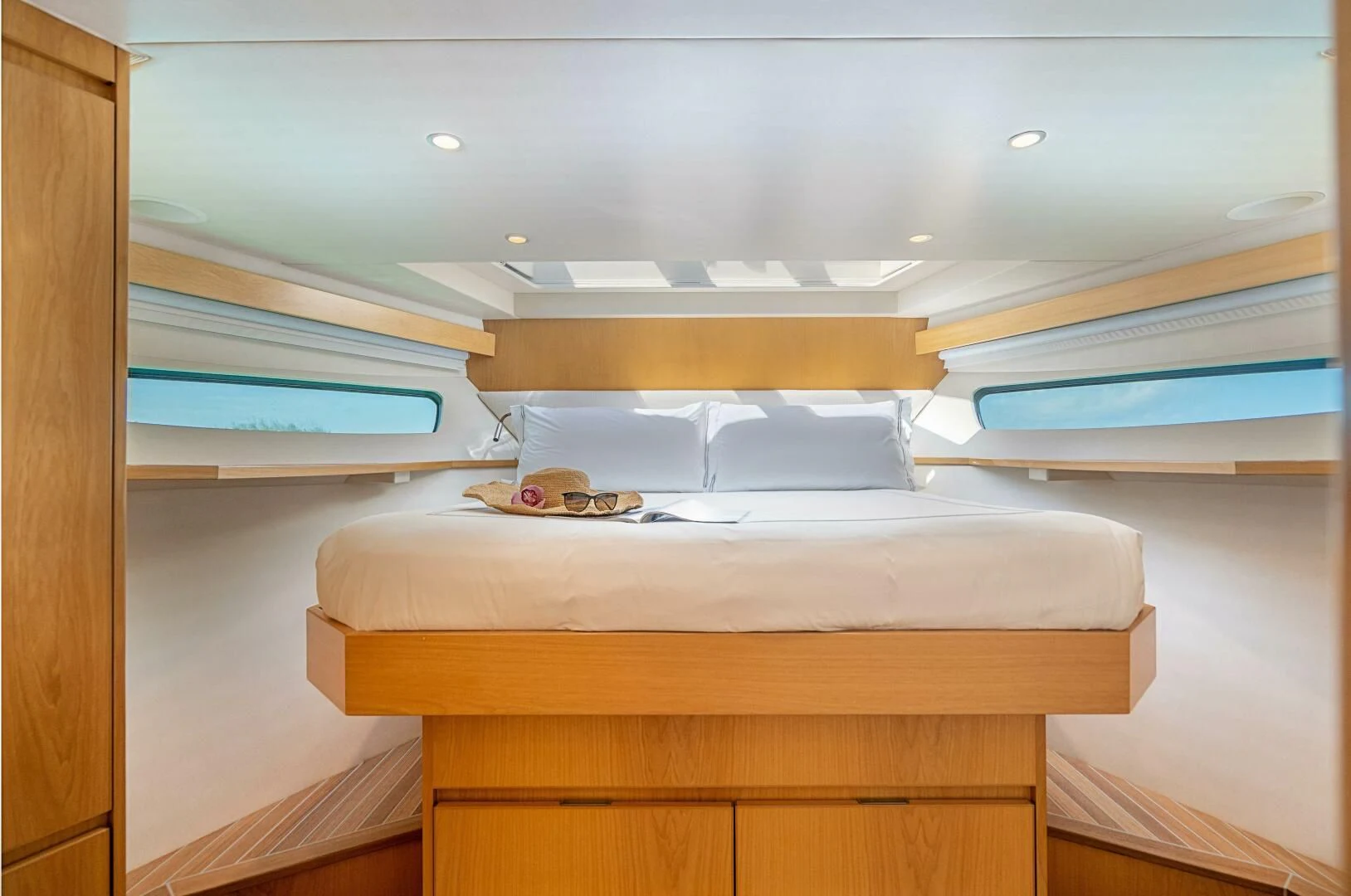 a bed with a wooden frame aboard MARYBELLE Yacht for Sale