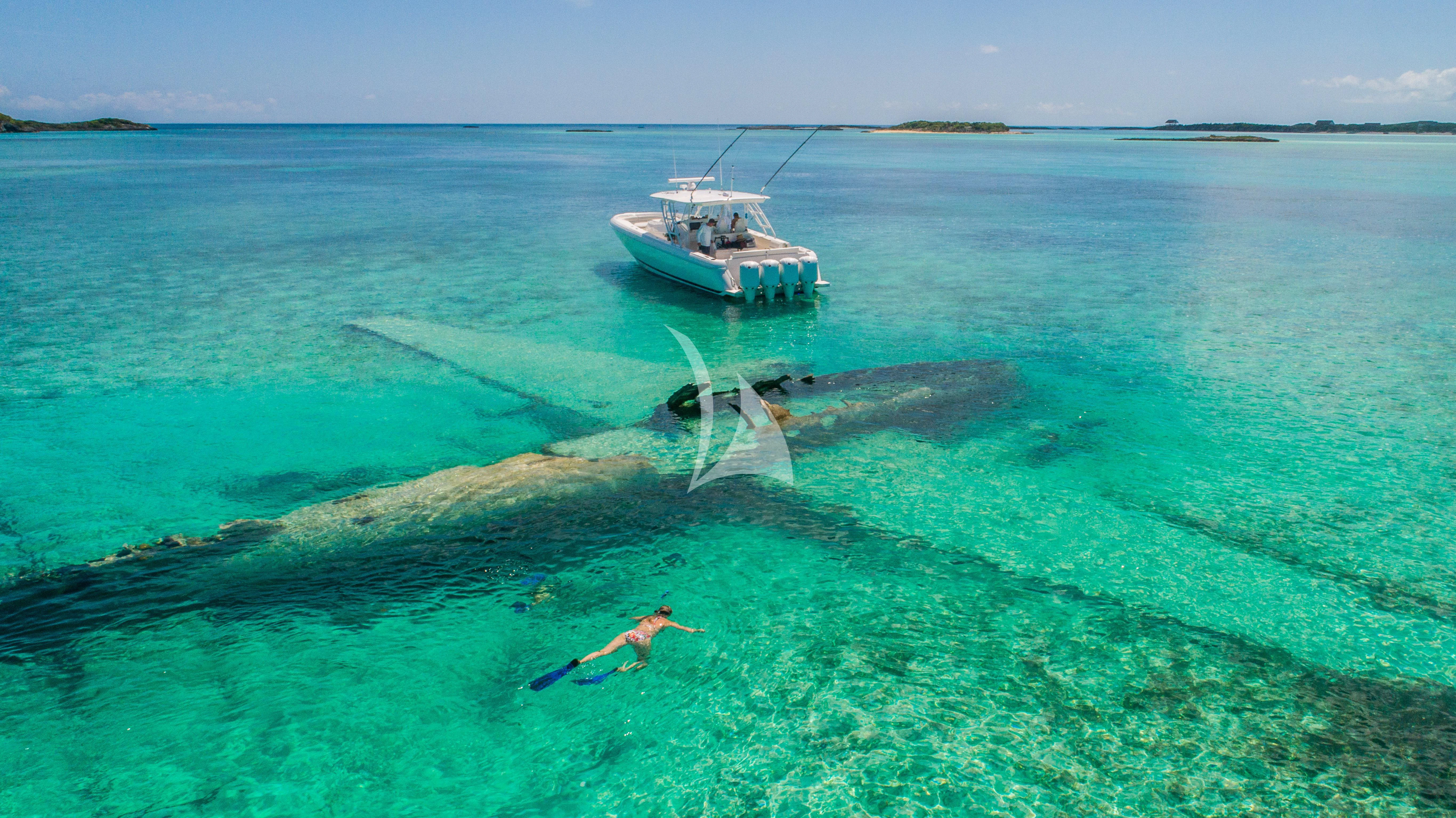 a helicopter flying over a body of water aboard MARYBELLE Yacht for Sale