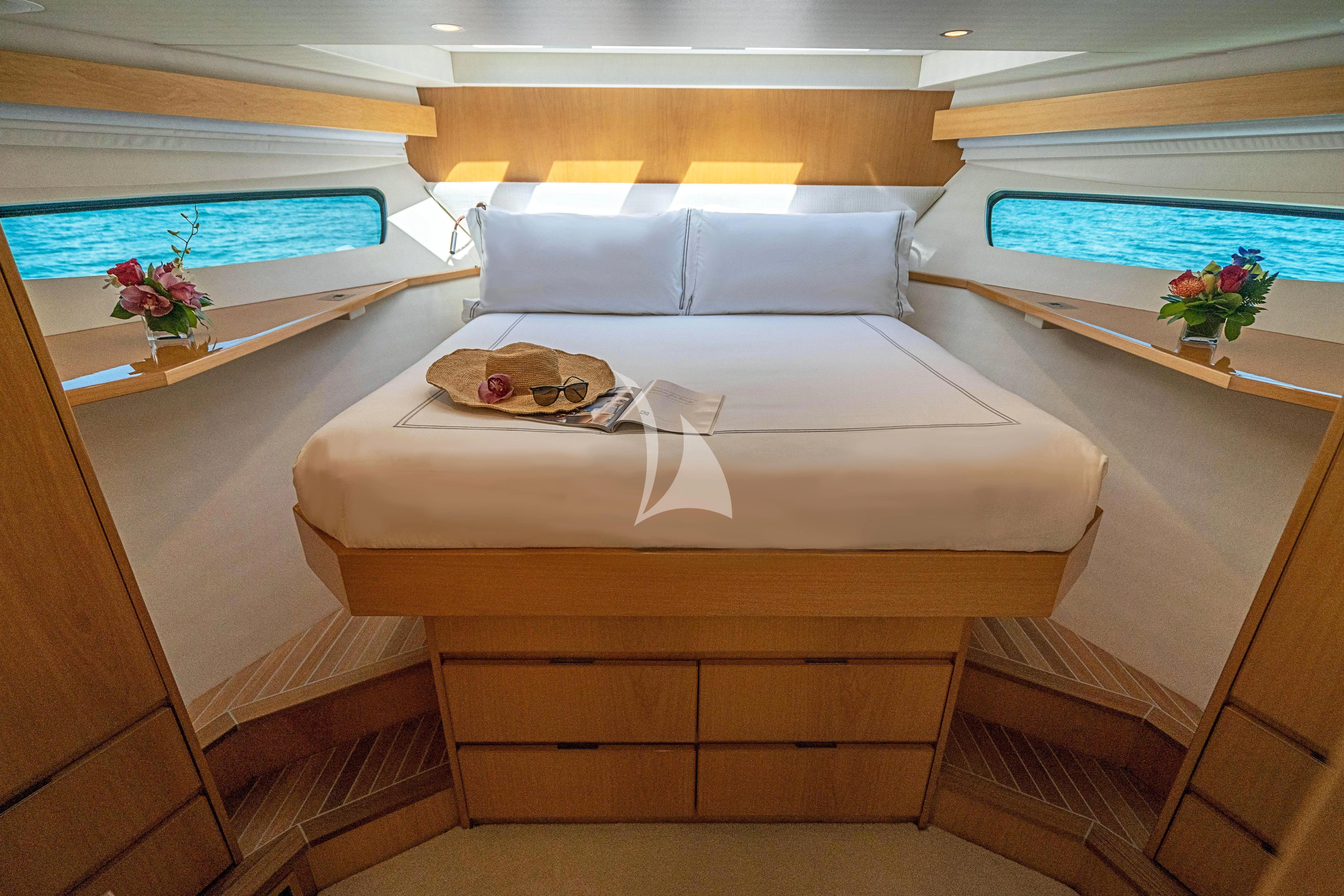 a bed with a white sheet aboard MARYBELLE Yacht for Sale