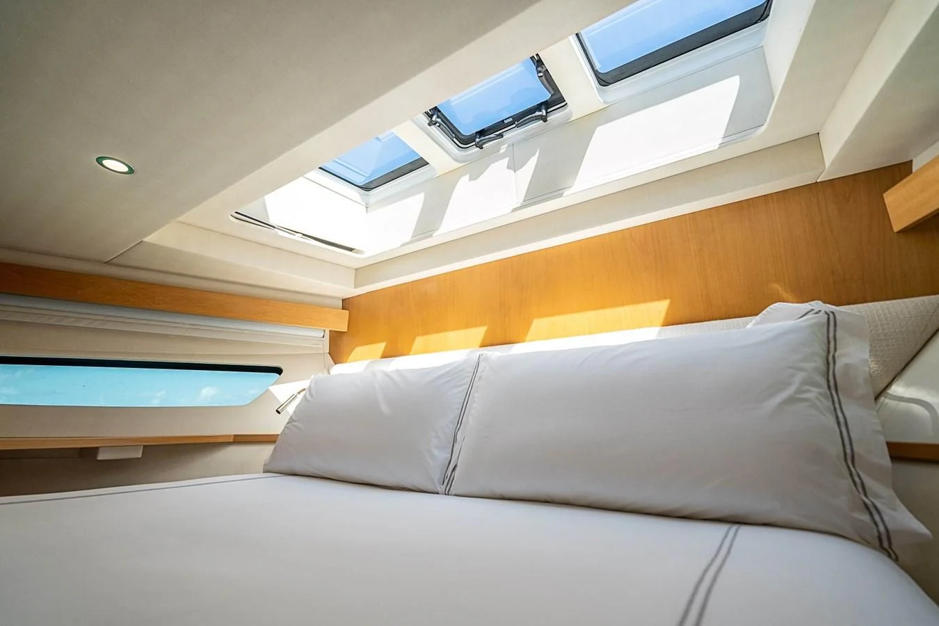 a bed with a laptop on top aboard MARYBELLE Yacht for Sale