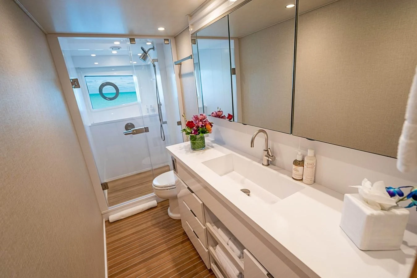 a bathroom with a glass shower door aboard MARYBELLE Yacht for Sale