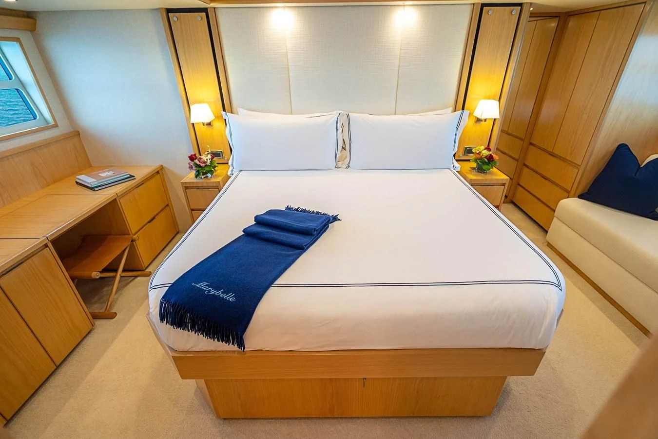 a bed with blue sheets aboard MARYBELLE Yacht for Sale