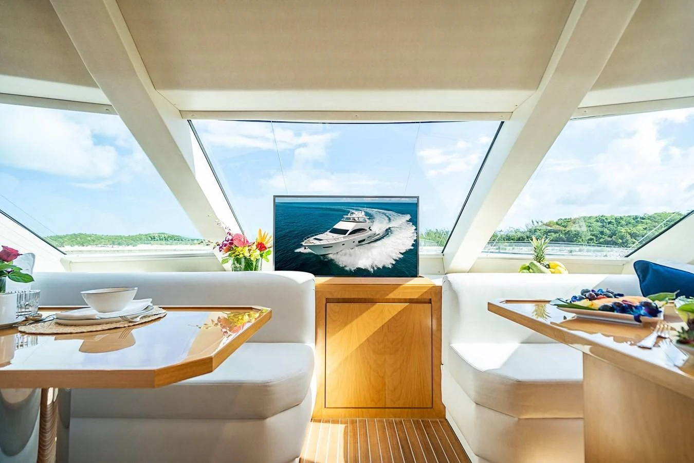 a room with a table and a painting on the wall aboard MARYBELLE Yacht for Sale