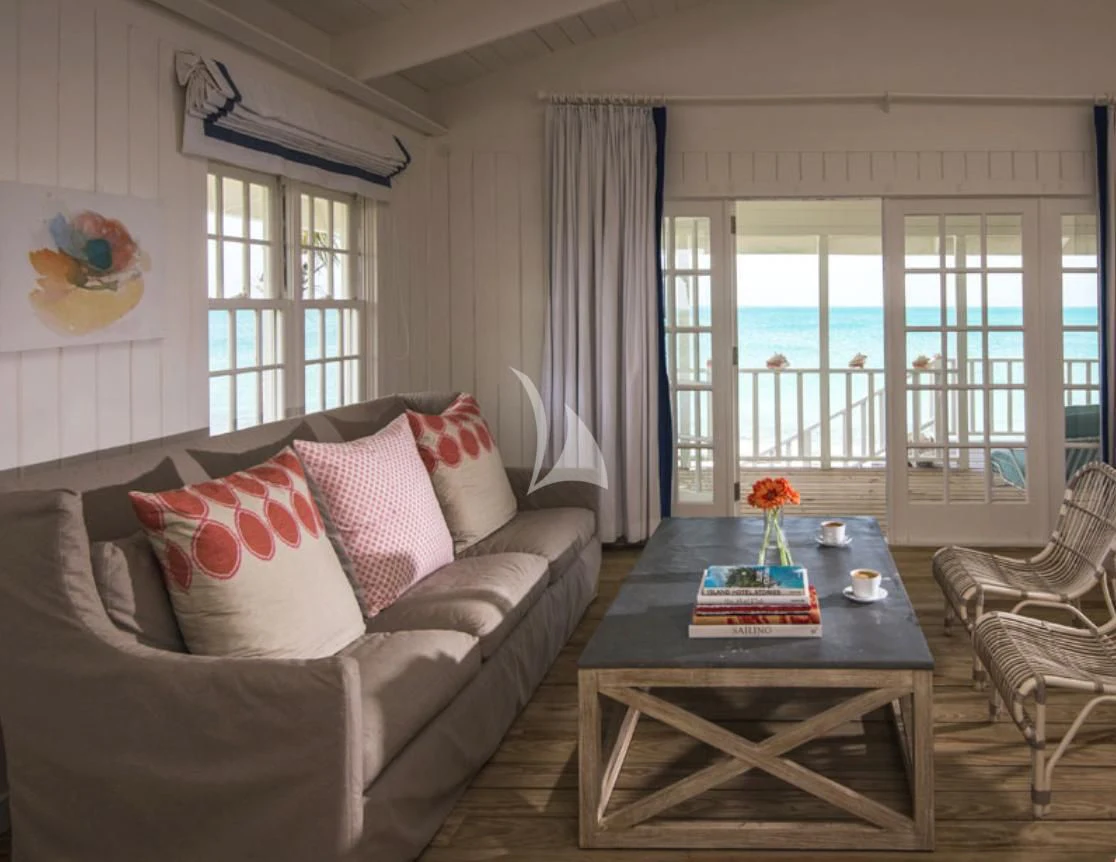 a living room with a table and chairs aboard MARYBELLE Yacht for Sale