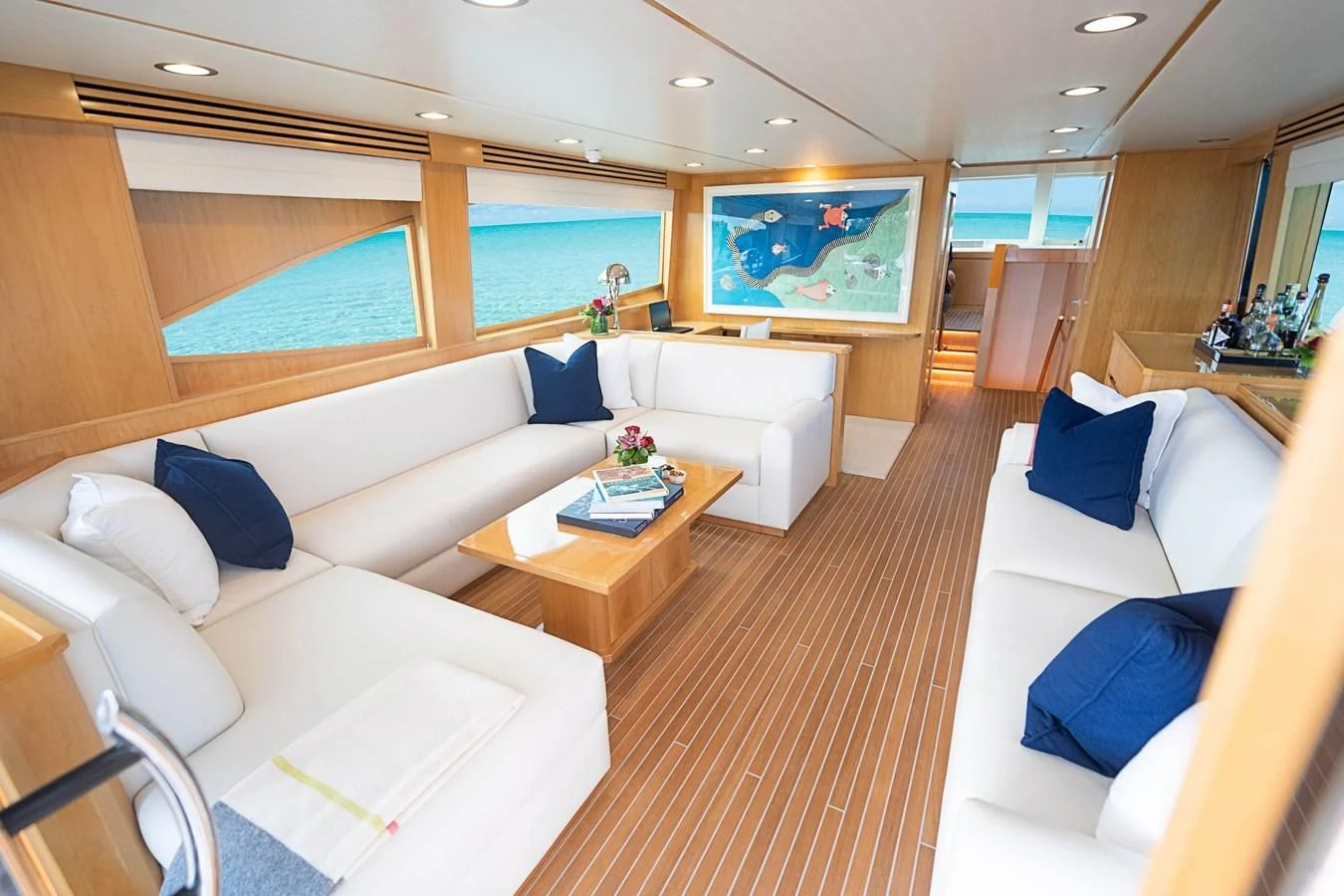 a living room with a couch and a table aboard MARYBELLE Yacht for Sale