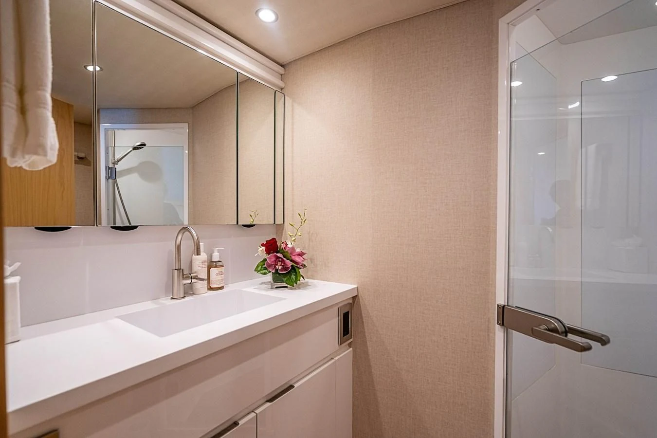 a bathroom with a sink and a mirror aboard MARYBELLE Yacht for Sale