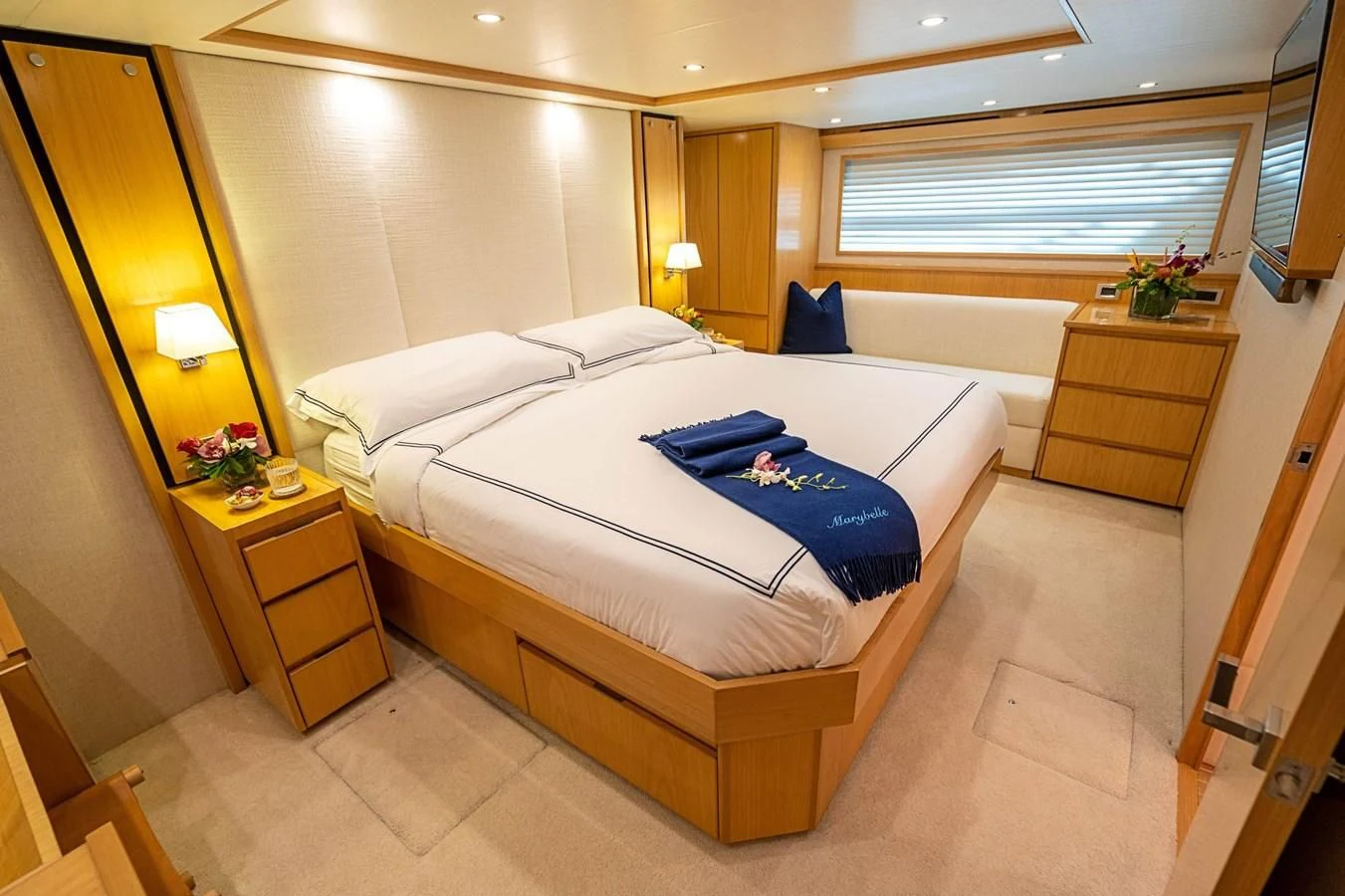 a bed with blue sheets aboard MARYBELLE Yacht for Sale