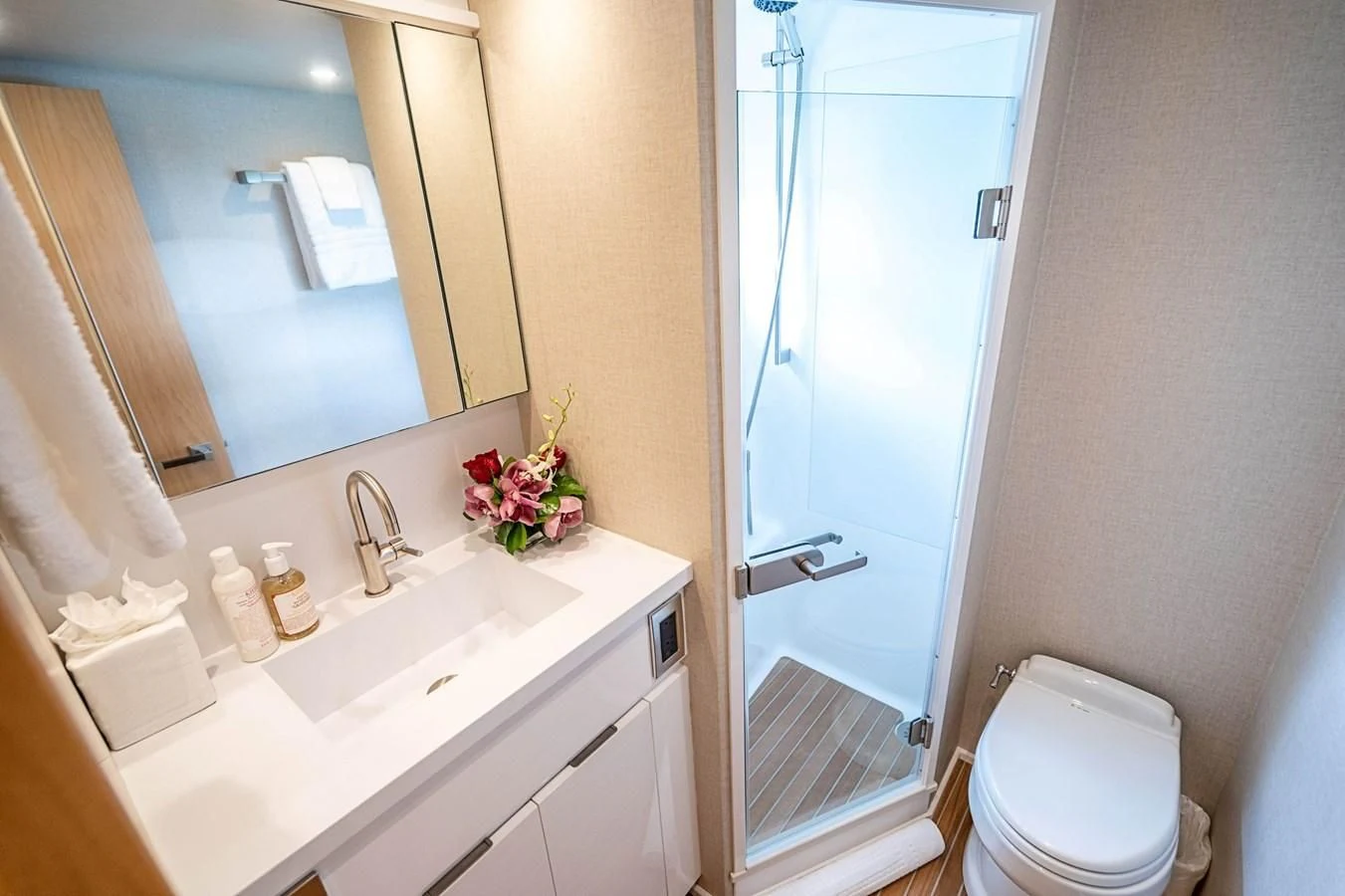 a bathroom with a glass shower door aboard MARYBELLE Yacht for Sale