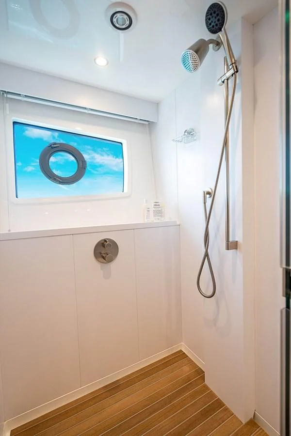 a shower with a painting on the wall aboard MARYBELLE Yacht for Sale
