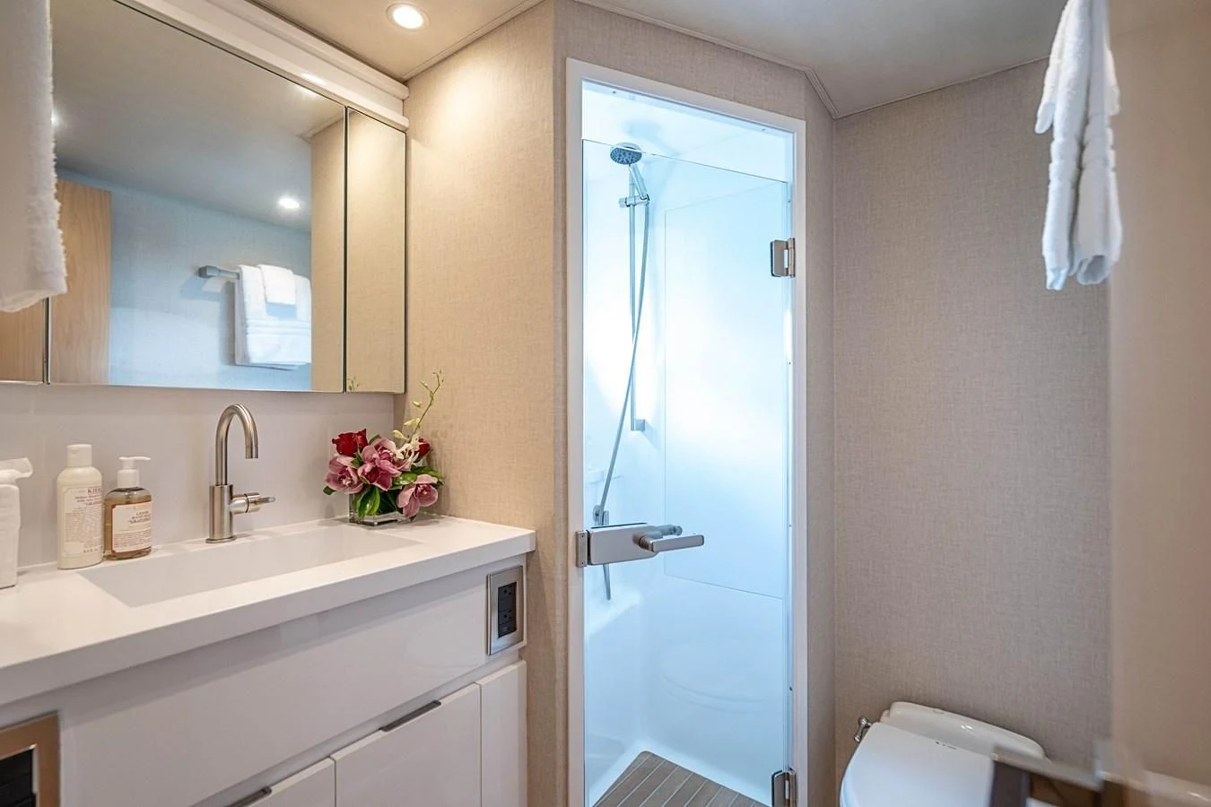 a bathroom with a glass shower door aboard MARYBELLE Yacht for Sale