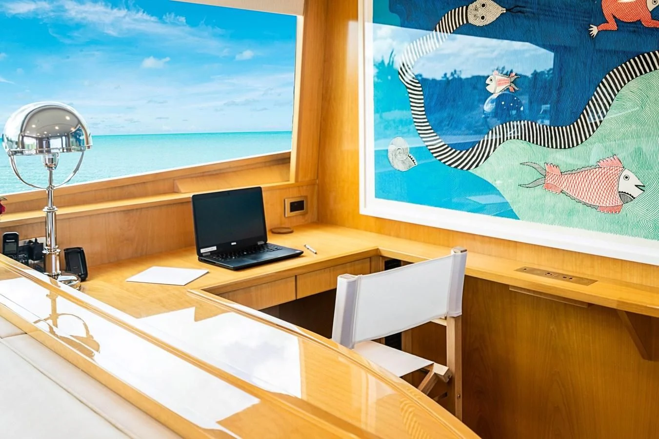 a laptop on a desk aboard MARYBELLE Yacht for Sale