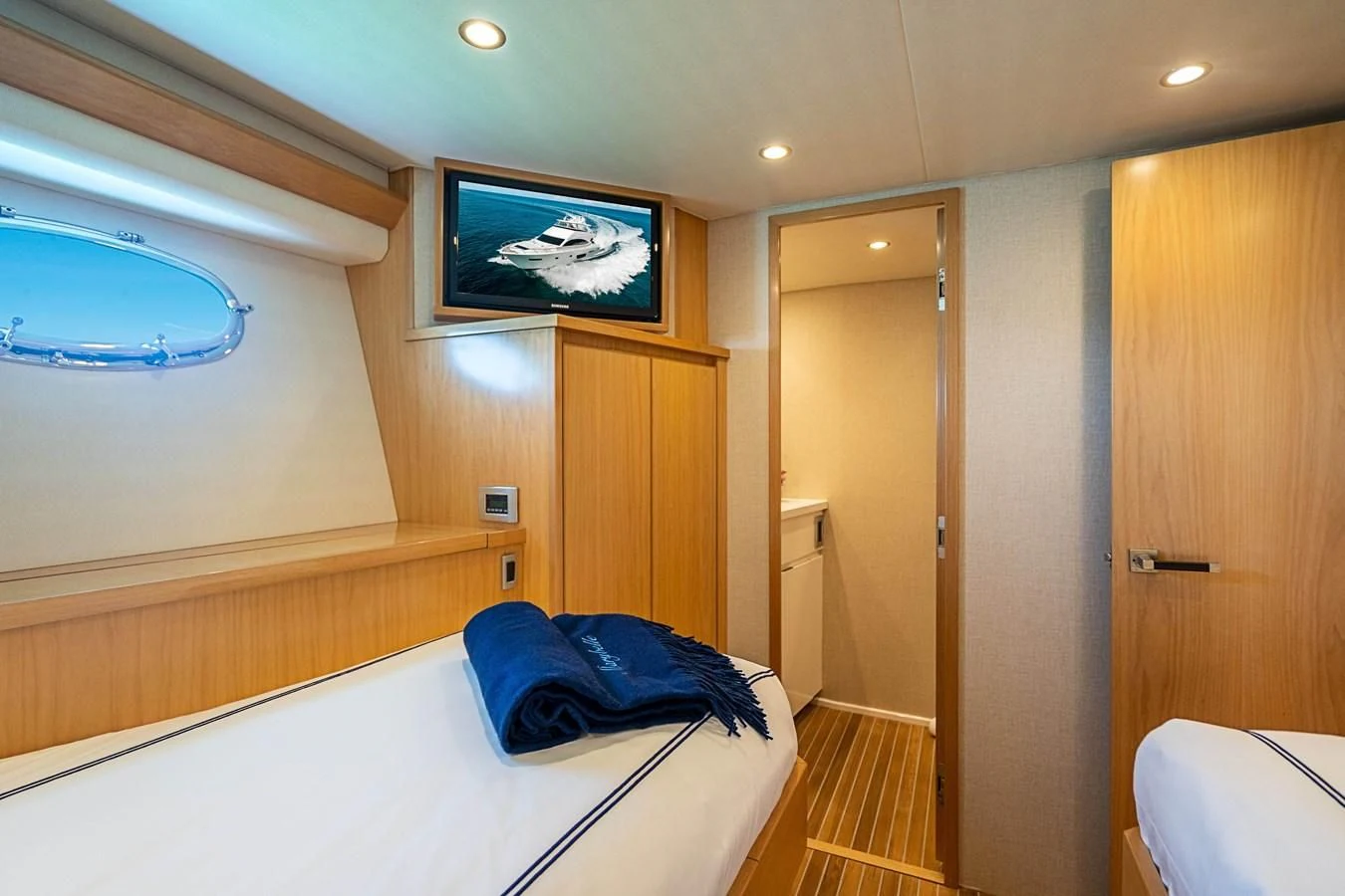 a room with a bed and a closet aboard MARYBELLE Yacht for Sale
