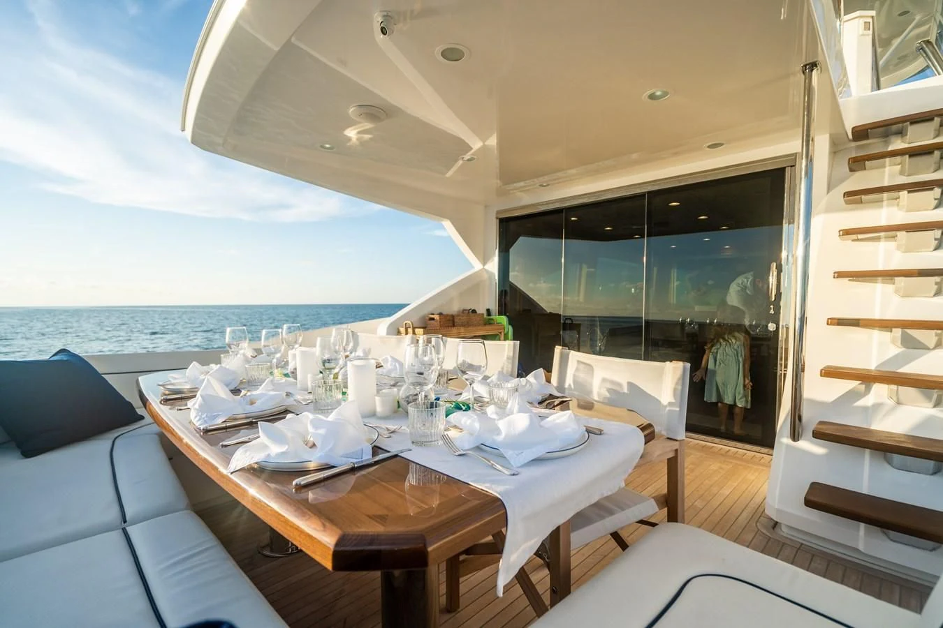 a dining table in a room with a view of the ocean aboard MARYBELLE Yacht for Sale