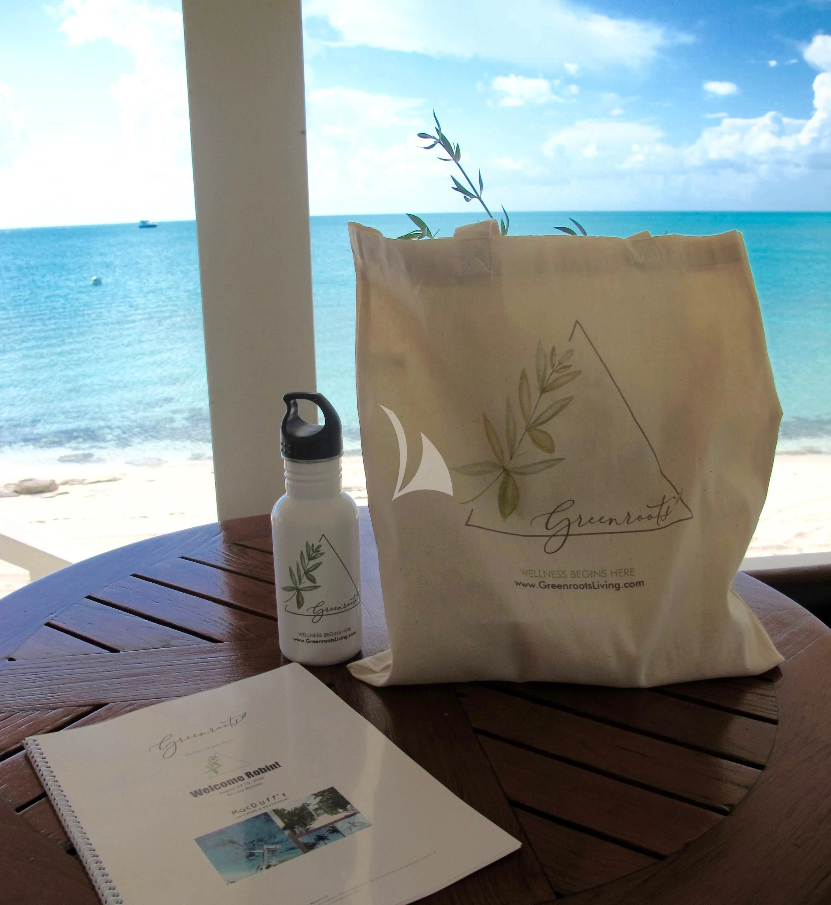 a bottle of wine and a book on a table aboard MARYBELLE Yacht for Sale