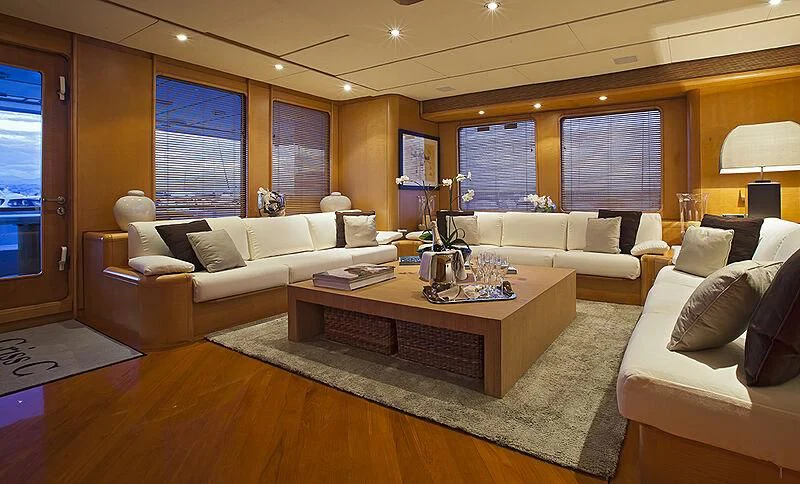 a living room with a couch and a coffee table aboard CRISS C Yacht for Sale