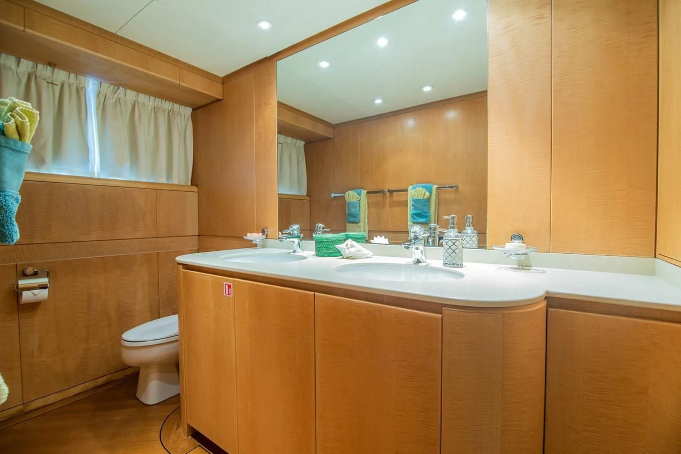 a bathroom with a sink and a toilet aboard CRISS C Yacht for Sale