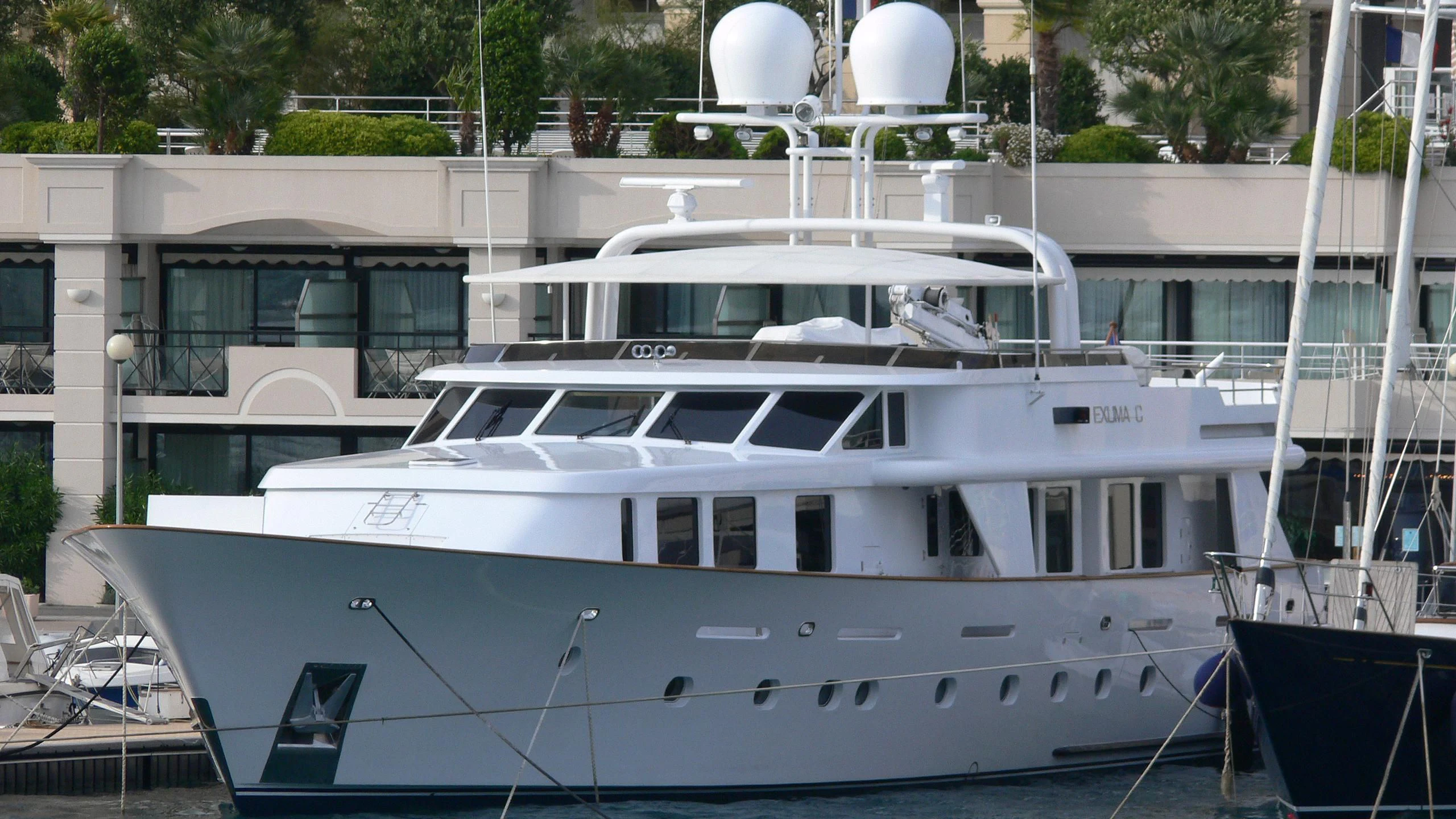 a white yacht docked aboard CRISS C Yacht for Sale