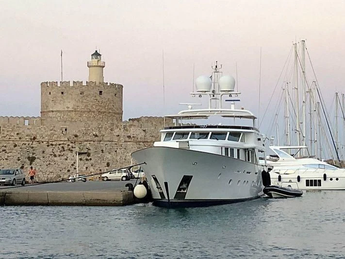 a boat docked at a dock aboard CRISS C Yacht for Sale