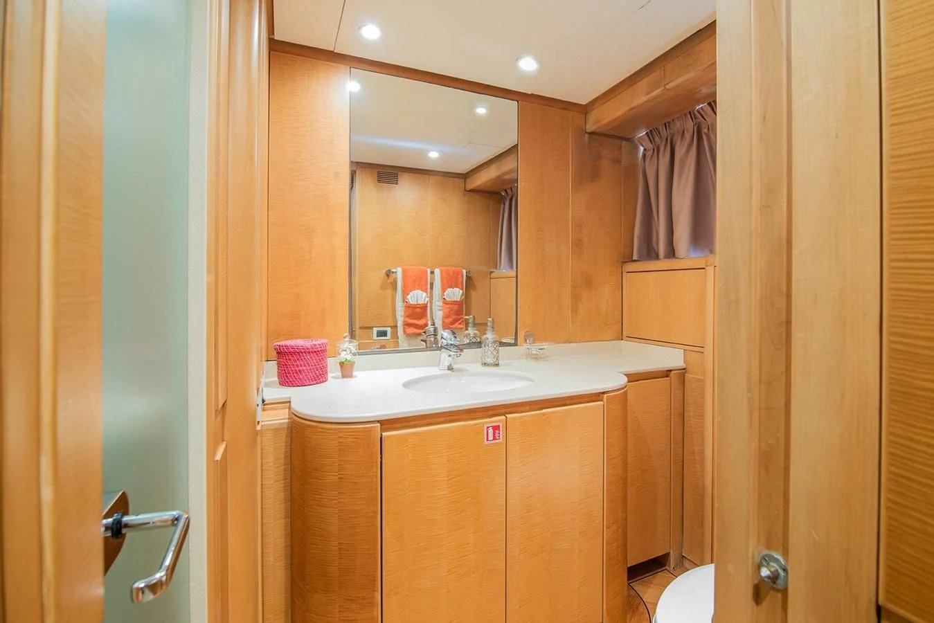 a bathroom with a sink and a mirror aboard CRISS C Yacht for Sale