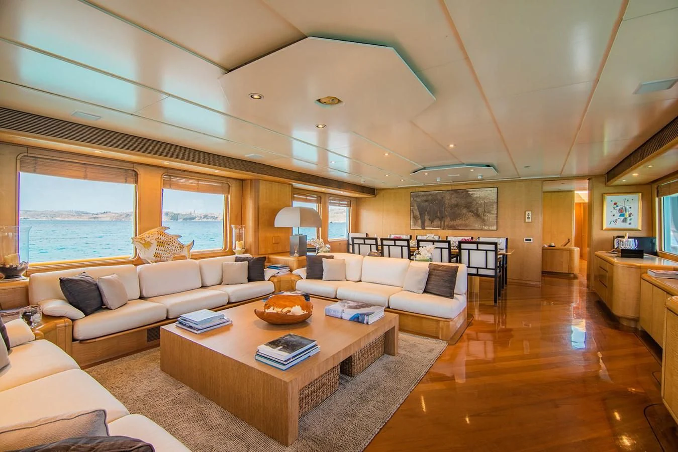a living room with a wood floor aboard CRISS C Yacht for Sale