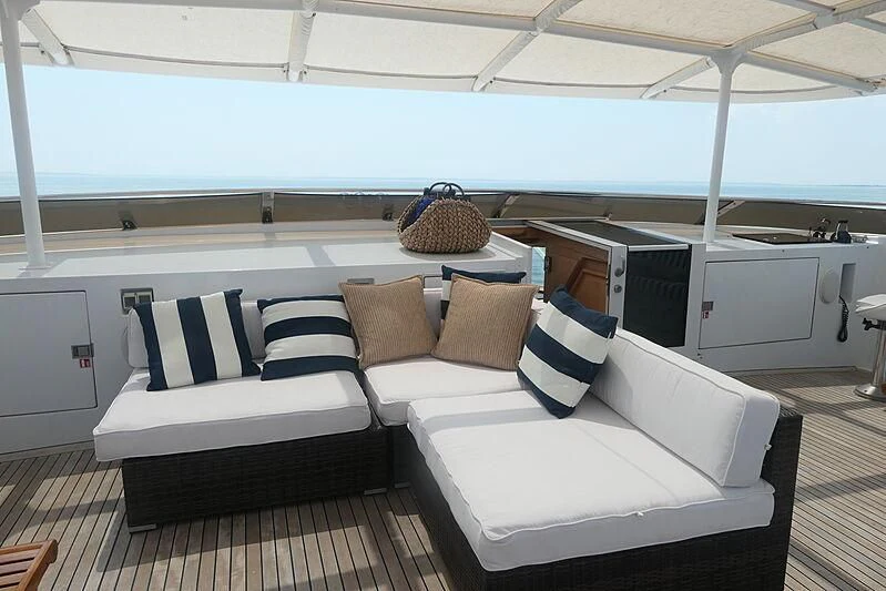 a room with a bed and a desk aboard CRISS C Yacht for Sale
