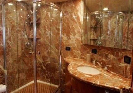 a bathroom with a glass shower aboard AURORA Yacht for Charter