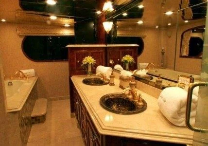 a bathroom with a sink and a mirror aboard AURORA Yacht for Charter