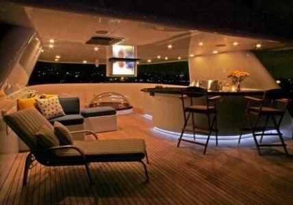 a room with a couch and a table and chairs aboard AURORA Yacht for Charter