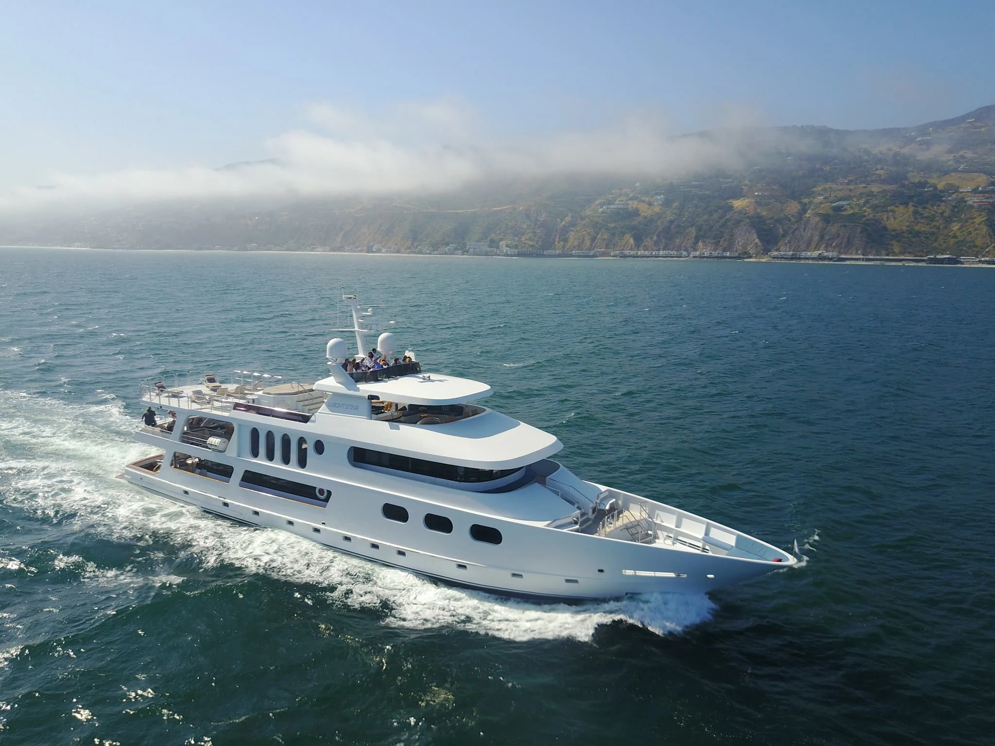 a white yacht on the water aboard AURORA Yacht for Charter
