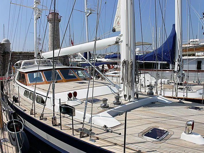 a group of boats are parked in a harbor aboard BLACK MOLLY Yacht for Sale