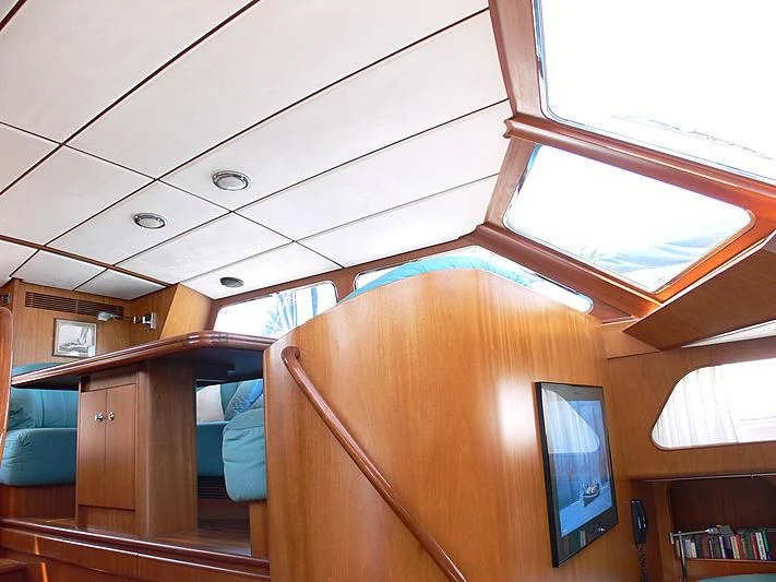 a room with a window and a television on the ceiling aboard BLACK MOLLY Yacht for Sale